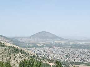 (Dom 4:6) The picture was taken just outside Nazareth, looking east towards Mount Tabor (Tavor) rising alone on the Jezreel Valley.